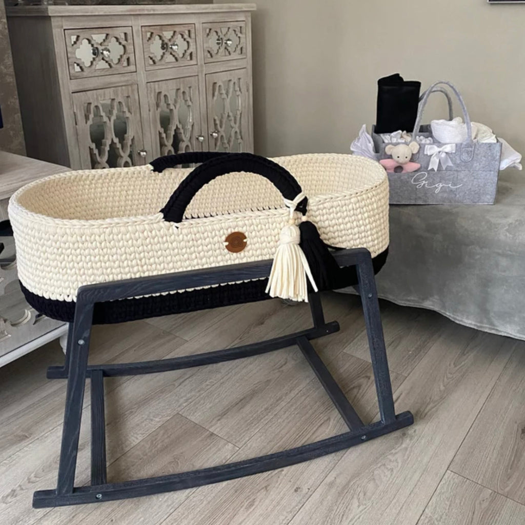 Black and white Moses basket with rocking stand