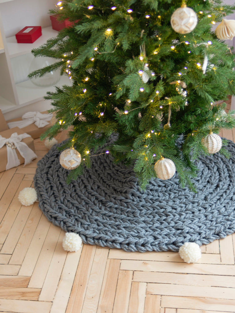 Gray knitted Christmas tree skirt with pompoms