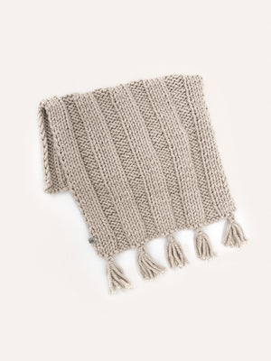Beige hand-knitted boho baby blanket with tassels – Anzy Home
