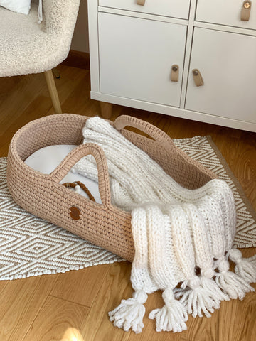 Boho knitted baby blanket in Moses basket by Anzy home.  for baby shower girl, boy or gender neutral reveal party